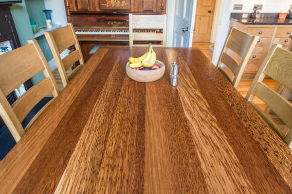 Trestle table top showing striped grain effect of the oak