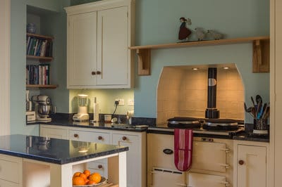 view of kitchen showing Aga range, mobile kitchen island